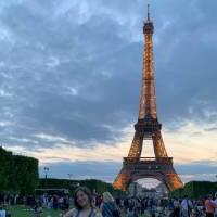 Student posing in front of Eiffel Tower